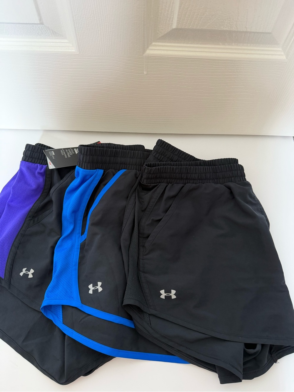 Under Armour Women’s bundle of 3 Athletic Shorts, 1 new 2 used